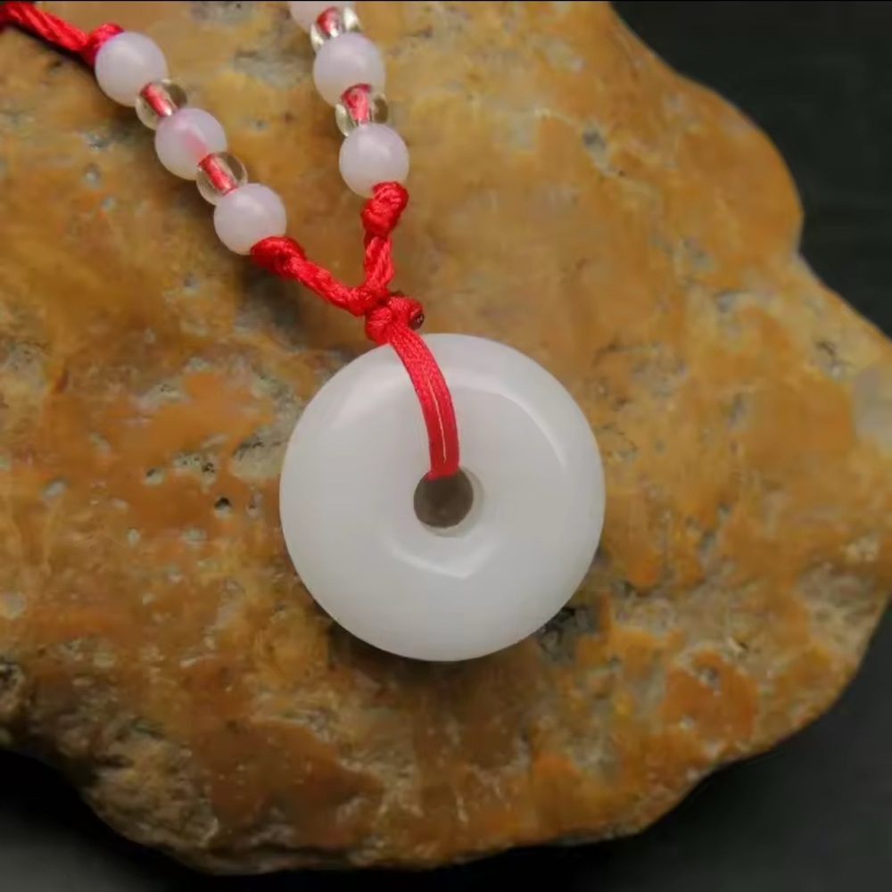 Elegant White Pendant Necklace with Red Cord Jade